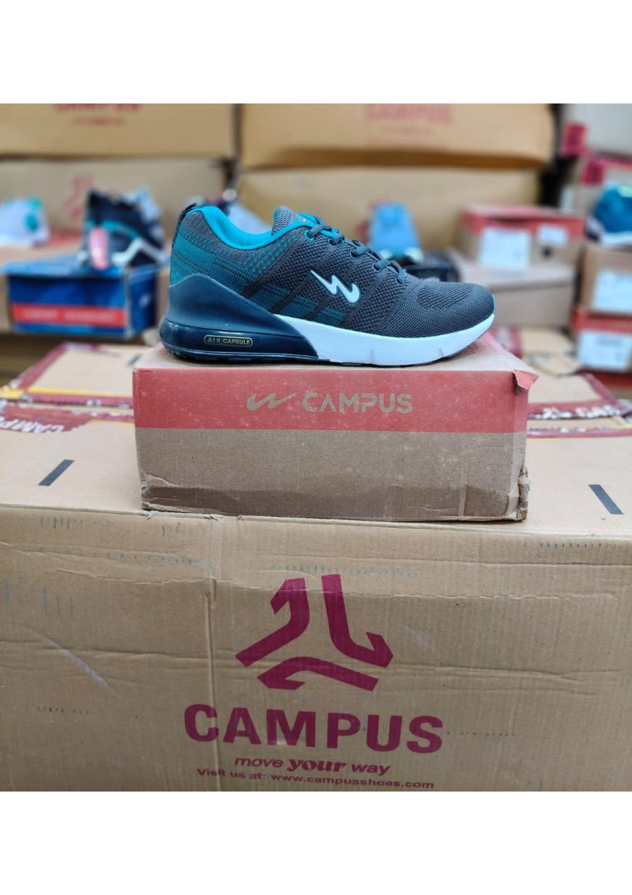 Side profile of a Campus Air Capsule men's running shoe in charcoal grey with teal accents and a visible heel air unit