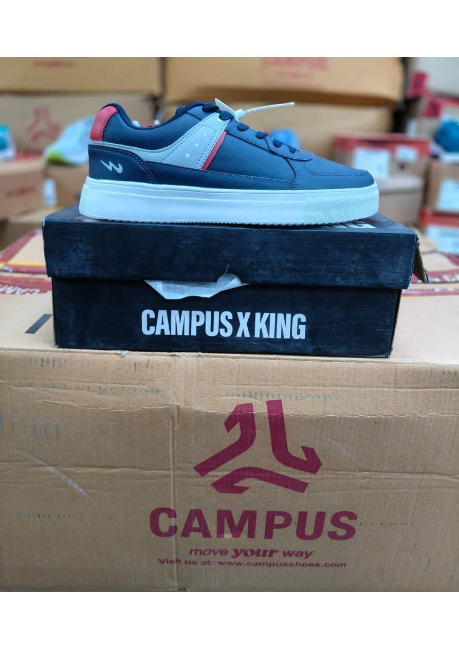 Navy Campus X King sneaker with grey star panel, red accents, and white sole on black branded box.