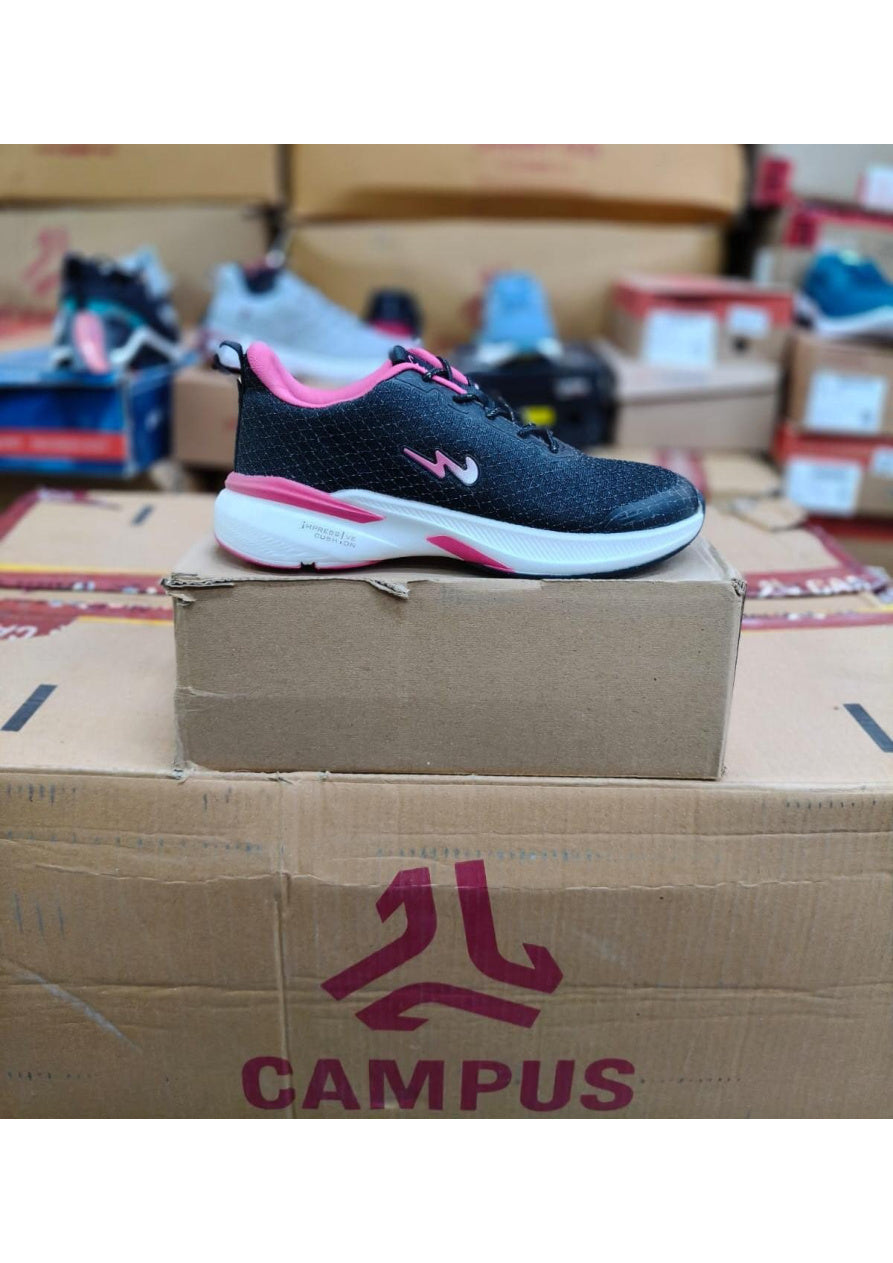 Side profile of a Campus Impressive Cushion women's sports shoe in black with hot pink accents and a thick white sole