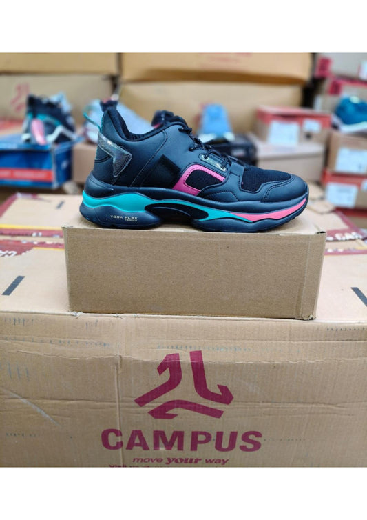 Side view of a Campus Yoga Flex women's sneaker in black with teal and pink chunky sole accents and reflective heel detail
