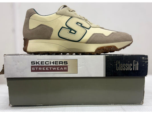 Cream and tan Skechers Streetwear Classic Fit sneaker with green S logo and gum sole on branded box.