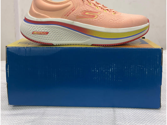 Side view of a peach Skechers GO RUN Slip-ins shoe with gradient midsole stripe and bungee laces