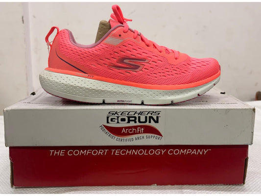 Bright coral Skechers GORUN Arch Fit running shoe with white Ultra Flight midsole on branded shoebox.