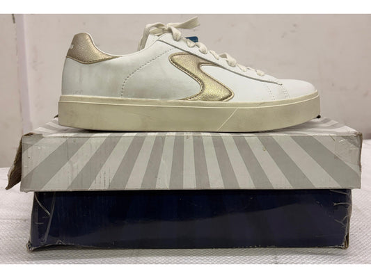 Side view of a white Skechers platform sneaker with metallic gold side accents and cream thick sole