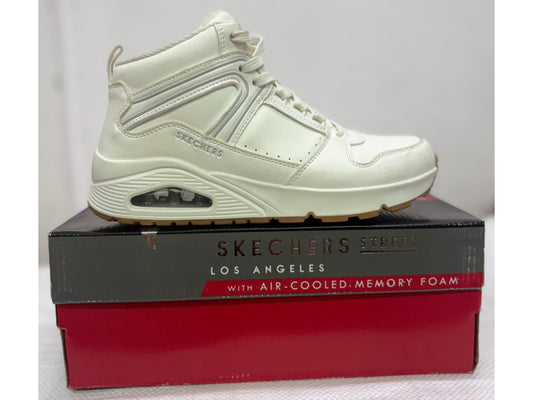 Off-white Skechers Street Los Angeles mid-top sneaker with visible air heel on grey and red box.
